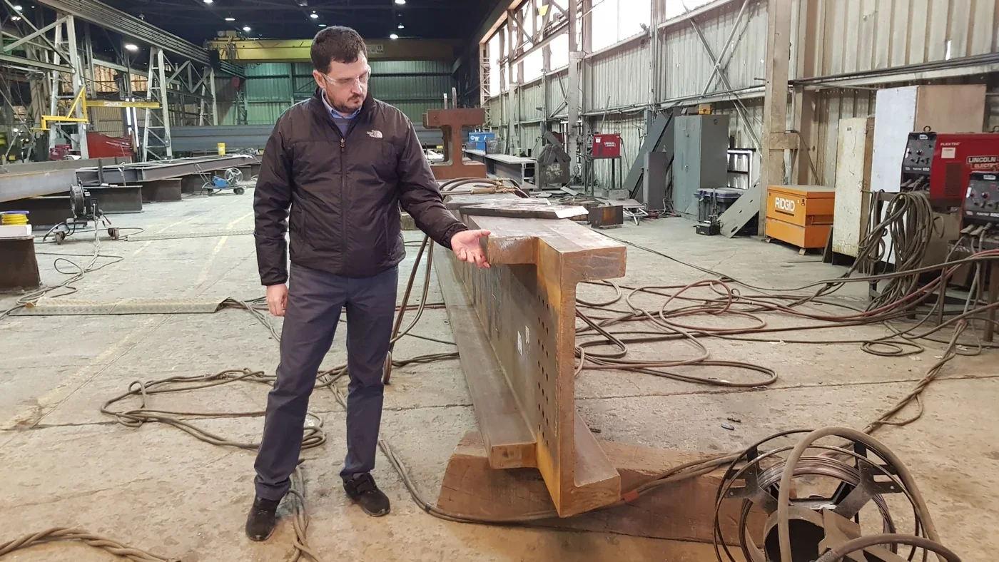 Reviewing steel components in a fabrication workshop